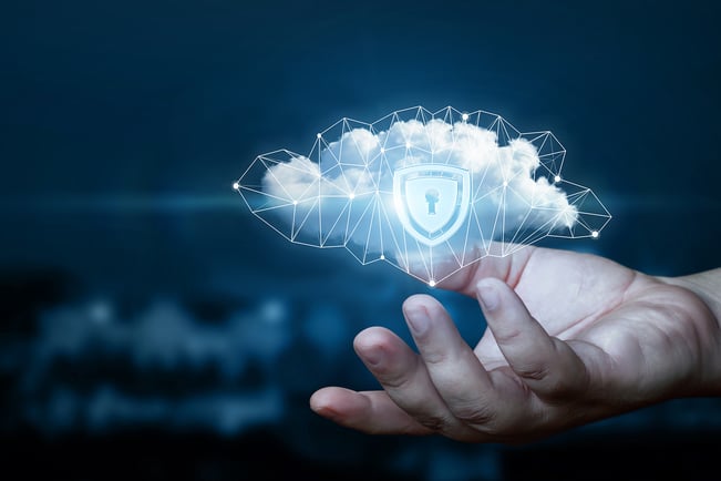 Hand shows a data cloud with a protective shield for cloud firewall